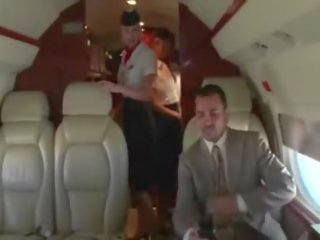 Oversexed stewardesses suck their clients hard penis on the plane